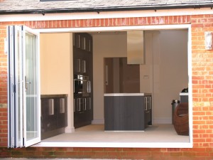 Kitchen with white bi-fold doors